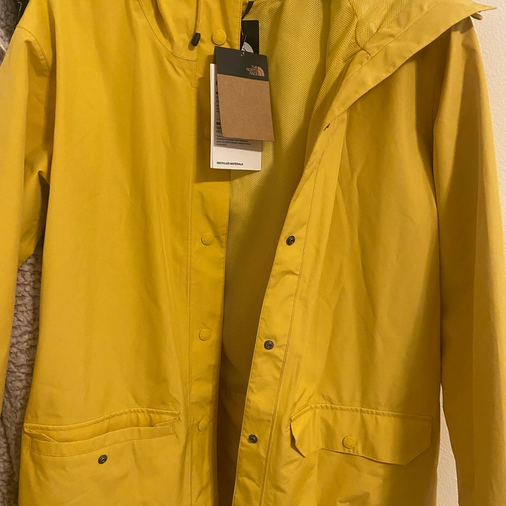 Yellow North face rain jacket brand new